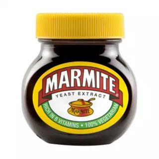 Marmite, the iconic British savory spread made with yeast extract. Spread it thin on toast for a delicious and nutritious breakfast rich in B vitamins. Explore its unique umami flavor.