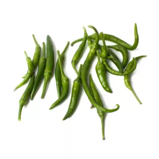 Add a fiery kick to your dishes with Fresh Indian Chillies. This 500g pack offers a variety of green and red chillies, perfect for adding a spicy touch to your cooking. Available at halalo.co.uk