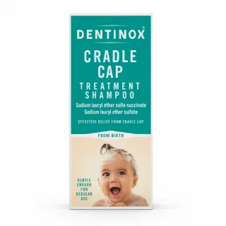 Dentinox Cradle Cap Treatment Shampoo front packaging with smiling baby image