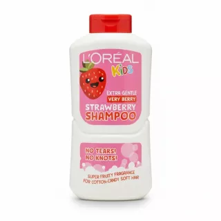 White L'Oréal Kids strawberry shampoo bottle with red cap and cartoon strawberry on the label