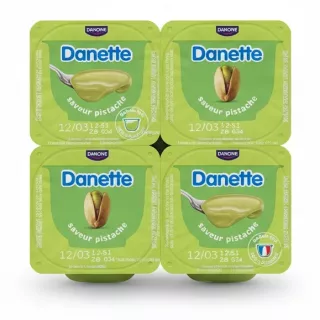 Four-pack of Danette pistachio cream dessert cups with green lids