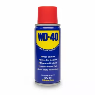 WD-40 multi-use lubricant spray can with red cap held in hand