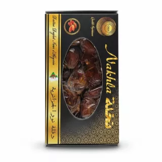 Box of Wakha premium Algerian dates showing rich brown dates through window