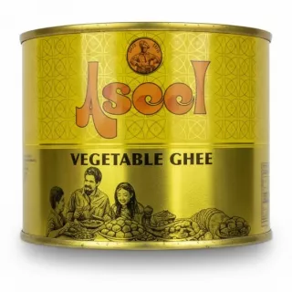 Ascol Vegetable Ghee 500ml golden tin held in hand