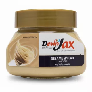 Jar of DevinJax Sesame Spread with golden lid and beige creamy contents inside