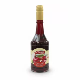 Bottle of Chtoura Fields Grenadine Syrup with gold cap and pomegranate label
