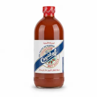 Front label of Crystal Hot Sauce bottle showing brand and hot pepper design