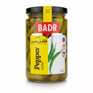 Jar of Badr pickled green peppers with yellow label