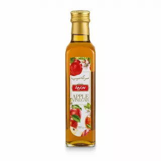 Glass bottle of Somayeh apple vinegar with apple and floral label design