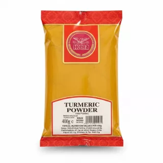 Packet of Heera turmeric powder in yellow and red packaging