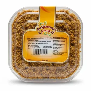 Anjoman Honey Konjed Sesame Sohan packaged in clear plastic container with label