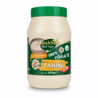 Alnakhla Tahini plastic jar with green lid and label displaying 100% natural sesame seed contents