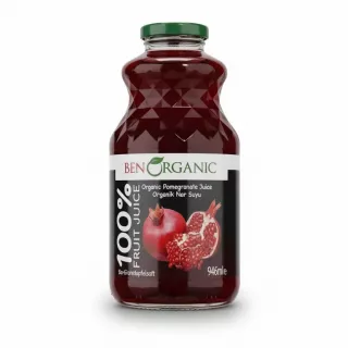 Glass bottle filled with dark red pomegranate juice with front label showing pomegranate image