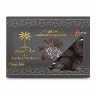 Box of Abu Taim Jordanian Medjool Dates with transparent window showing dates inside