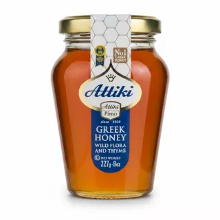 Jar of Attiki Greek Honey Wild Flora & Thyme, clear glass with golden lid