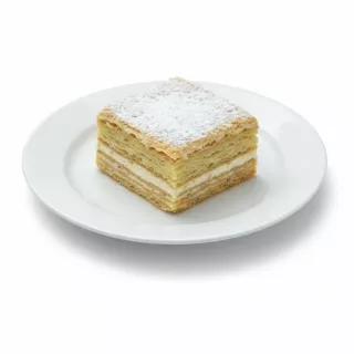Single Napoleon Mille-Feuille square on white plate topped with powdered sugar