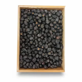 Box filled with dark, plump Ajwa dates