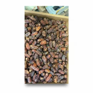 Close-up of a box filled with premium brown dates