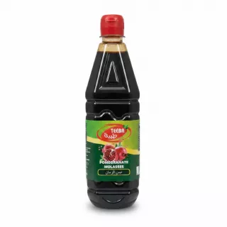 Bottle of Teeba Pomegranate Molasses showing front label with red cap