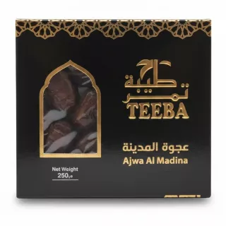 Box of Teeba Ajwa Al Madina Dates in black packaging with gold decorative elements