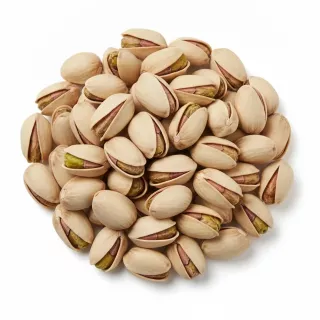 Close-up of raw pistachio nuts in their shells
