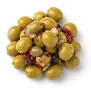 close-up of green olives marinated with garlic and red pepper in brine