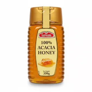 Bottle of Garusana 100% Acacia Honey, 350g, with yellow label and gold cap