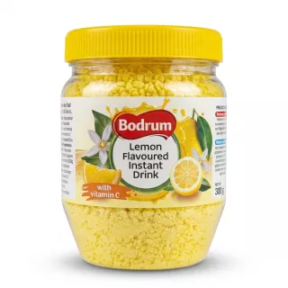 Enhanced Hand holding Bodrum Lemon Flavoured Instant Drink 300g jar close-up