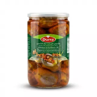 Enhanced Front view of Durra Makdous in Sunflower Oil 880g jar held in hand