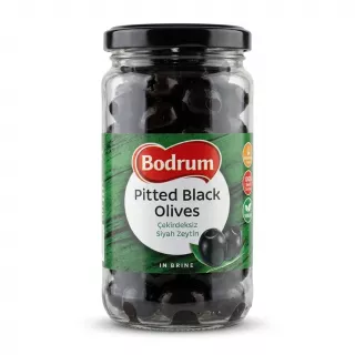 Enhanced Front view of Bodrum Pitted Black Olives jar held in hand in a store aisle