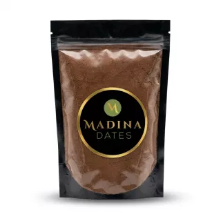 Enhanced A resealable pouch of Madina Dates date powder held in hand