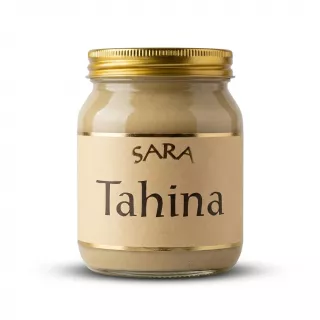 Enhanced Front view of a Sara Tahina glass jar with gold lid and beige label
