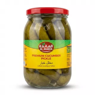 Al Maeda Premium Cucumber Pickle in a 1450g glass jar with a red lid. The jar is packed with whole pickled cucumbers and features a distinct yellow and green label with the brand logo in Arabic and English, centered against a clean white background.