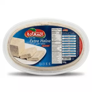 Enhanced Alsaadah Extra Halva with Tahini 700g oval tub featured in supermarket setting with price label