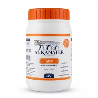 Enhanced Front of Al Kanater Tahini jar 450g in a person's hand