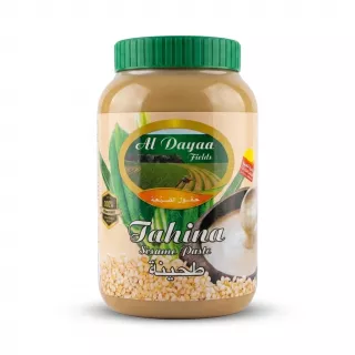 A 1:1 professional e-commerce product photograph of an 800g jar of Al Dayaa Fields Tahina Sesame Paste, centered on a clean white background with soft, even shadowing. The product features a prominent green and white label with imagery of green fields and sesame seeds, and clear text in both English and Arabic.