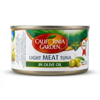 Enhanced A can of California Garden Light Meat Tuna in Olive Oil held in hand in a grocery store aisle