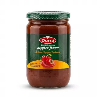 Enhanced Front view of Durra Pepper Paste 650g jar held in hand in a grocery aisle