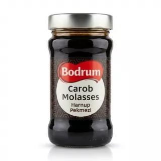 Enhanced Front of Bodrum Carob Molasses jar held in hand