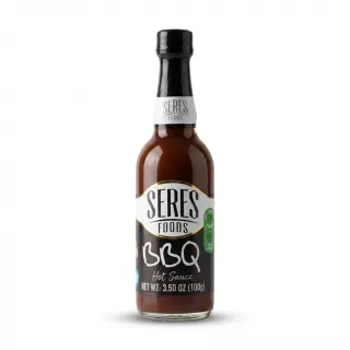 Enhanced Hand holding a bottle of Seres Foods BBQ Hot Sauce 100g