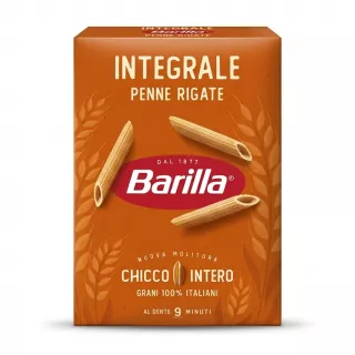 A professional 1:1 e-commerce product photograph of a 500g box of Barilla Wholemeal Penne Rigate pasta on a clean white background. The orange-brown box is centered and takes up 85% of the frame. It displays the text "INTEGRALE PENNE RIGATE" and "Barilla," along with illustrations of wheat and three dry penne pasta pieces. All text and graphics are sharp and clear.