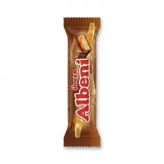 Enhanced Hand holding an Ülker Albeni Chocolate Caramel Bar in a shop