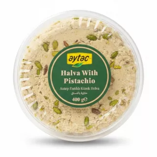 Top view of Aytac Pistachio Halva in clear resealable container showing pistachio pieces