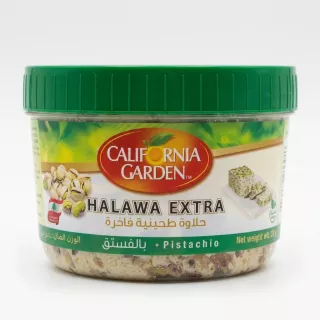 A 400g tub of California Garden Halawa Pistachio Extra, featuring a green lid and detailed packaging, centered on a clean white background with soft, symmetrical shadows. The labels are sharp and legible, showing the product name and a cluster of green pistachios.