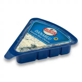 A side profile of a triangular blue plastic container containing a wedge of Adoro Danablu Danish Blue Cheese, with visible blue-veined texture through the clear seal, isolated on a pure white background with a soft even shadow.