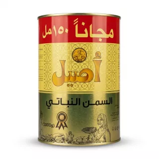 A professional studio photograph of an Aseel Vegetable Fat tin with Arabic branding in gold, red, and yellow, presented on a pure white background with a soft, even shadow. The tin is centrally positioned and fills the frame, showcasing the "Aseel" name and decorative packaging details in sharp focus.