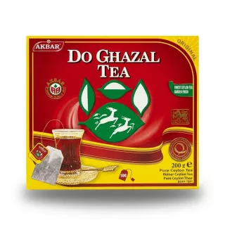 A 200g box of Akbar Do Ghazal Tea Bags featuring a red background, a traditional two-deer logo, a teacup, and 100 tea bags. PRODUCT: Akbar Do Ghazal Tea Bags (200g box) The product is a 200g cardboard box of Akbar Do Ghazal Tea Bags. The box features a red background with yellow borders. In the center, there is a green emblem with two white deer and four white leaf shapes. Above this emblem, the words "DO GHAZAL" are displayed in a white, ornate font, with "TEA" in a smaller white font below it. The top left corner contains the red and yellow "AKBAR" logo. To the right of the deer emblem, text reads: "FINEST CEYLON TEA GARDEN FRESH" in a white font on a green background. On the far right is a gold and red Ceylon Tea quality seal. In the bottom right corner, the text shows: "200 g e" and "Pure Ceylon Tea" and "Reiner Ceylon Tee" and "Pure Ceylon Thee" and "BOPF 'SP'". The bottom left corner has a picture of a clear glass of brewed tea with a matching tea bag steeping, resting on a small, ornate gold saucer. Above the glass, a white banner text says "PURE CEYLON TEA". Next to the tea bag graphic, a red and gold number 100 is visible with "TEABAGS" written underneath it. A yellow strip runs along the bottom, and a thin, vertical decorative gold line is present on the right side. The overall appearance is a clean, sharp, professional e-commerce product shot with a subtle, symmetrical soft shadow.