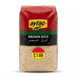 A 1kg pack of Aytac Foods Brown Rice, featuring its red, green, and black packaging with a special price sticker, centered in sharp focus on a clean white background.