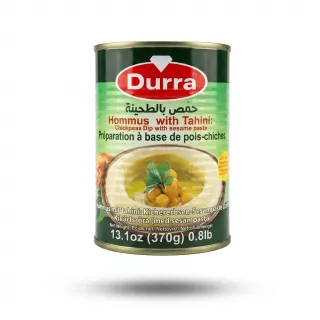Enhanced Enhanced Front of Durra Hommus with Tahini 370g tin held in hand