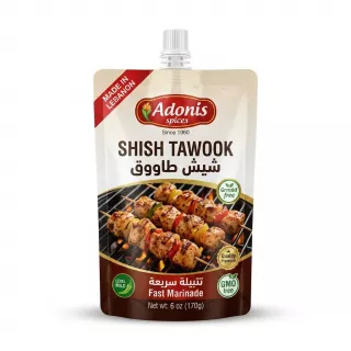 A 6 oz pouch of Adonis Spices Mild Shish Tawook Fast Marinade, showing the product label with grilled chicken skewers.